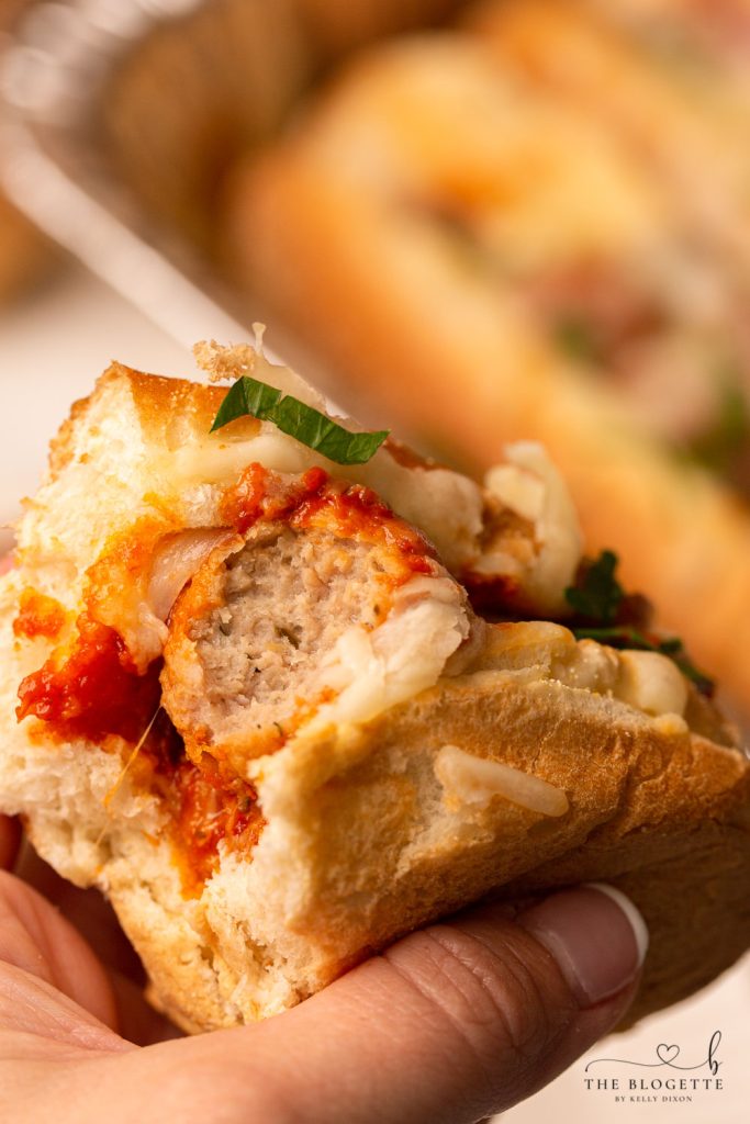Baked Meatball Subs are packed with lots of melty cheese! Everyone loves this easy dinner. Baked with meatballs in a delicious marinara sauce and bubbly cheese on top.