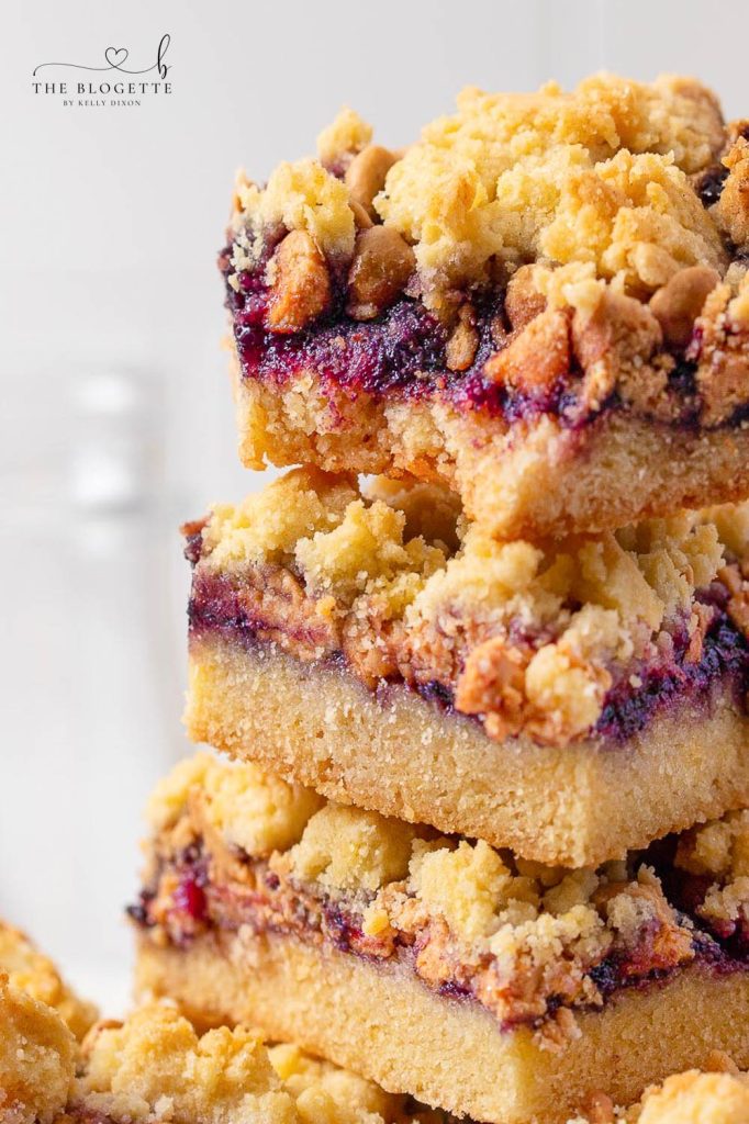 Peanut Butter and Jelly Cookie Bars - Made with your favorite peanut butter pieces, these PB&J Bars turn a classic sandwich into a yummy cookie treat!