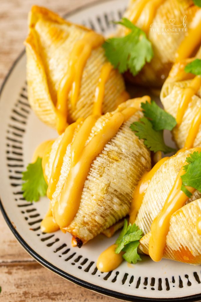 Air Fryer Taco Stuffed Shells recipe features seasoned ground beef and ooey-gooey cheese melted inside of slightly crisp air-fried shells.