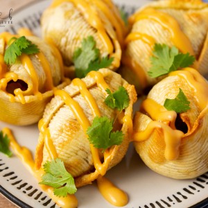 Air Fryer Taco Stuffed Shells recipe features seasoned ground beef and ooey-gooey cheese melted inside of slightly crips air-fried shells.