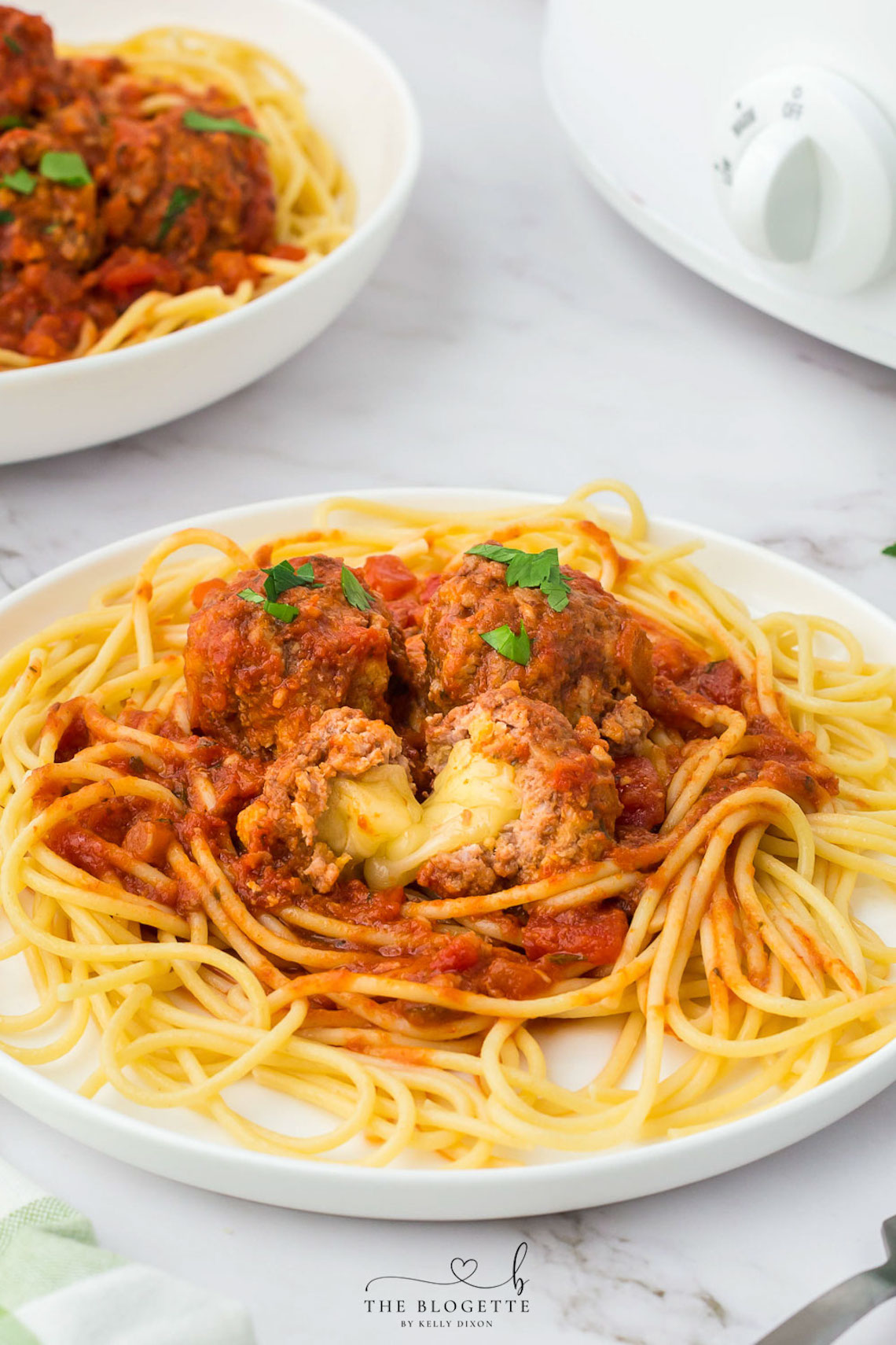 Juicy Crock Pot Cheese Stuffed Meatballs are one way to spice up everyone's favorite pasta. Nothing says home cooking like a good plate of spaghetti with homemade sauce and meatballs.
