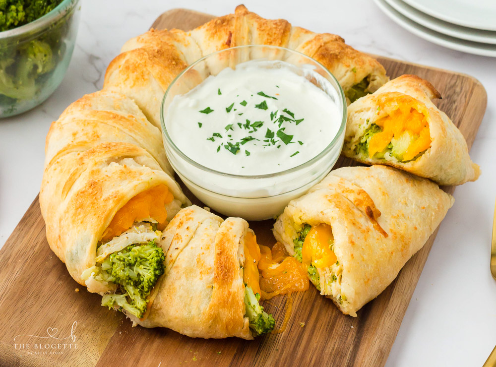 This delicious Cheesy Chicken and Broccoli Ring recipe looks impressive, tastes amazing, and uses up leftover chicken! It's easy to make and is so versatile that it can be an appetizer, a lunch, or a dinner.