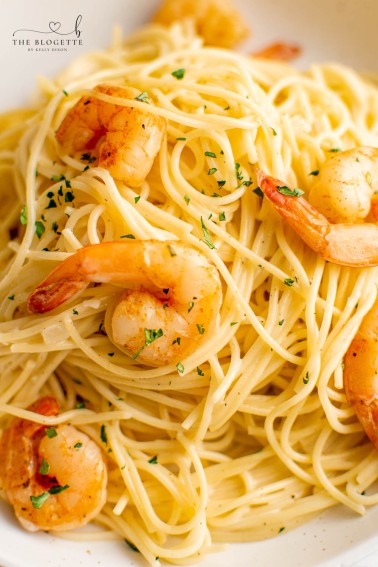 Garlic Butter Shrimp Scampi Pasta is large, juicy shrimp in garlic butter tossed in a creamy pasta. This shrimp scampi recipe is easy to make!