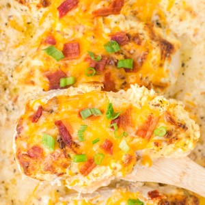 This Million Dollar Chicken recipe is easy, cheesy, and smothered in a special cream sauce, then topped with bacon!