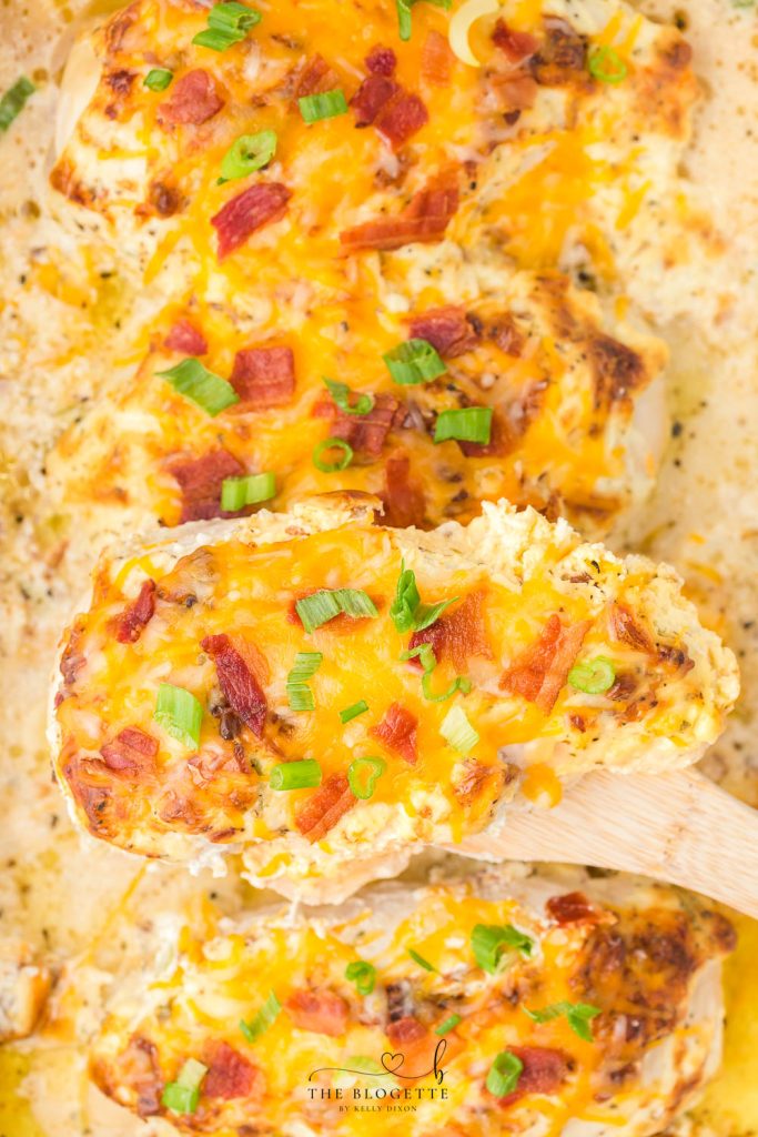 This Million Dollar Chicken recipe is easy, cheesy, and smothered in a special cream sauce, then topped with bacon! 