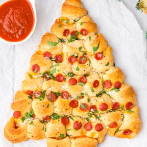 A pepperoni and cheese Christmas Tree Pull Apart Bread is the perfect Christmas appetizer! Easy, versatile, and makes everyone smile!