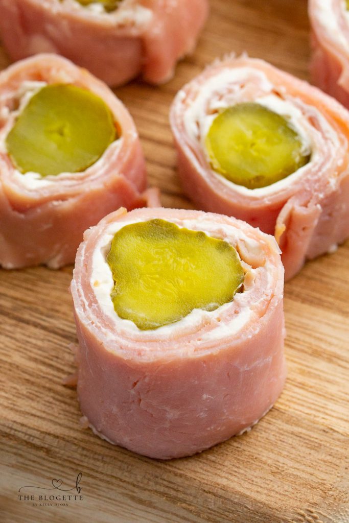 Ham and Pickle Roll Ups are one of the best appetizers ever! Ham, cream cheese, and pickles rolled up into a tasty easy appetizer.