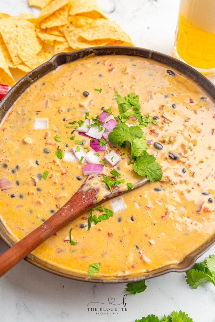 Loaded Queso Dip is full of flavor, packed with beef, beans, cheese, and even beer! Perfect appetizer with chips at parties or on game day!