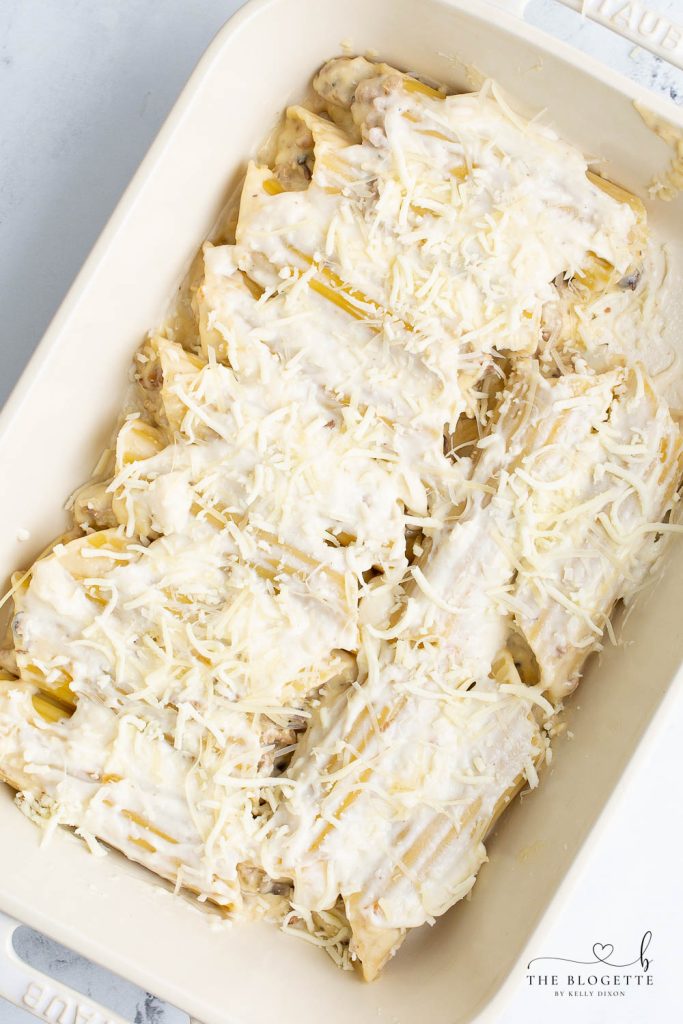 Cannelloni covered in a creamy cheese sauce