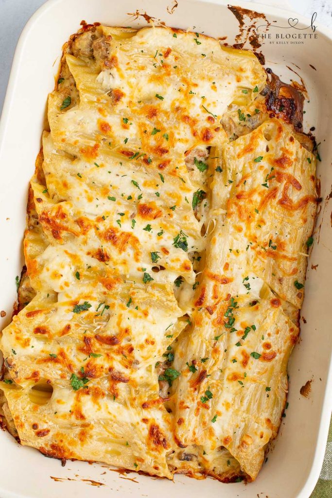 Baked Cannelloni are large pasta shells stuffed with sausage, mushrooms, and cheese, then covered in a creamy sauce!