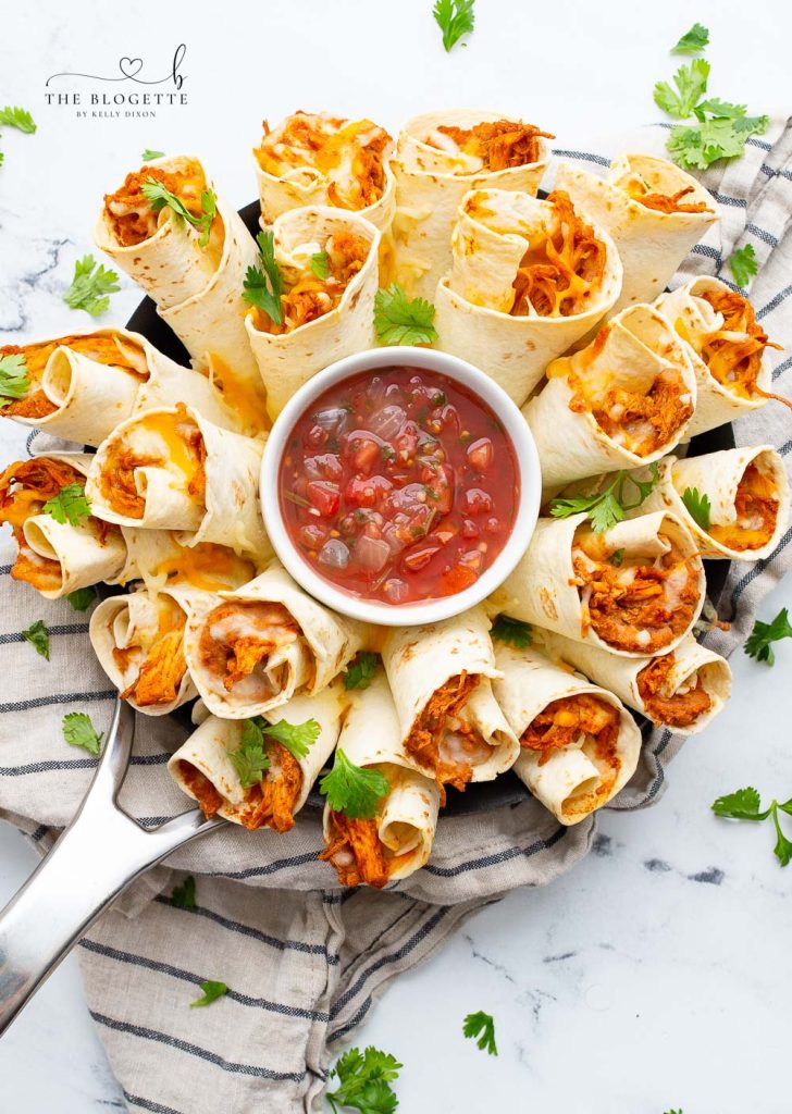 A Blooming Burrito Ring is the perfect appetizer for any occasion! A round display of chicken and bean burritos served with a bowl of dip. 