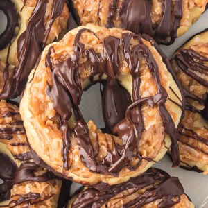 Homemade Samoa Cookies are a copycat version of everyone's favorite Girl Scout Cookie! These big, thick, and buttery shortbread cookies melt in your mouth and are packed with chocolate, caramel, and coconut.