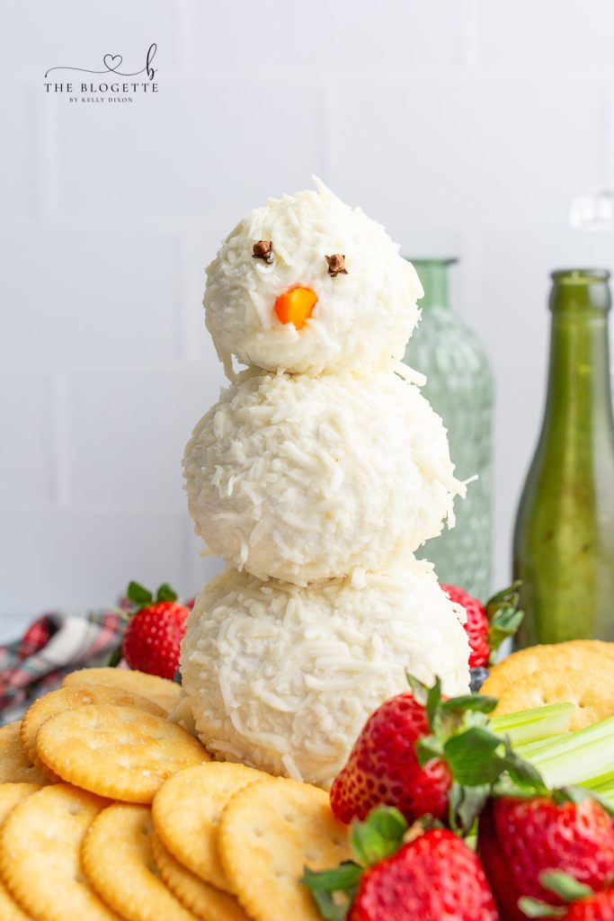 An adorable Snowman Cheeseball is what every winter gathering needs! This is simply the cutest winter appetizer that everyone will love.