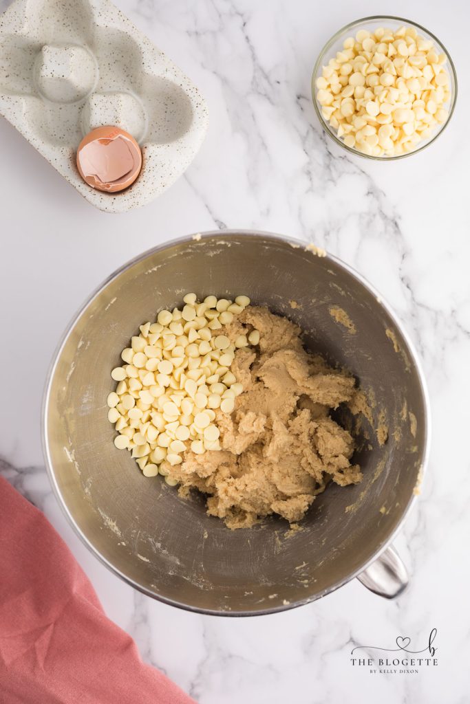 Adding white chocolate chips to cookie dough