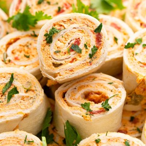 Chicken Enchilada Roll Ups are the perfect appetizer or snack for any party or occasion. This make-ahead appetizer is made with easy-to-find ingredients like taco seasoning, cream cheese, and shredded chicken (or leftover chicken!).