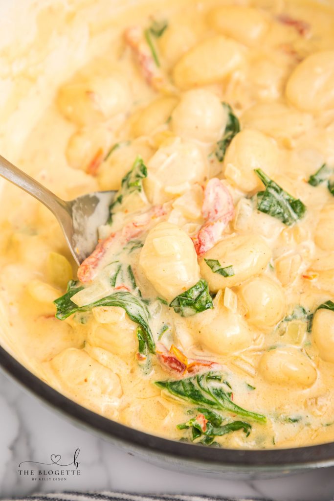 Creamy Tuscan Gnocchi - Soft gnocchi cooked in a cream sauce with sun-dried tomatoes, spinach, and garlic. Done in just 20 minutes!