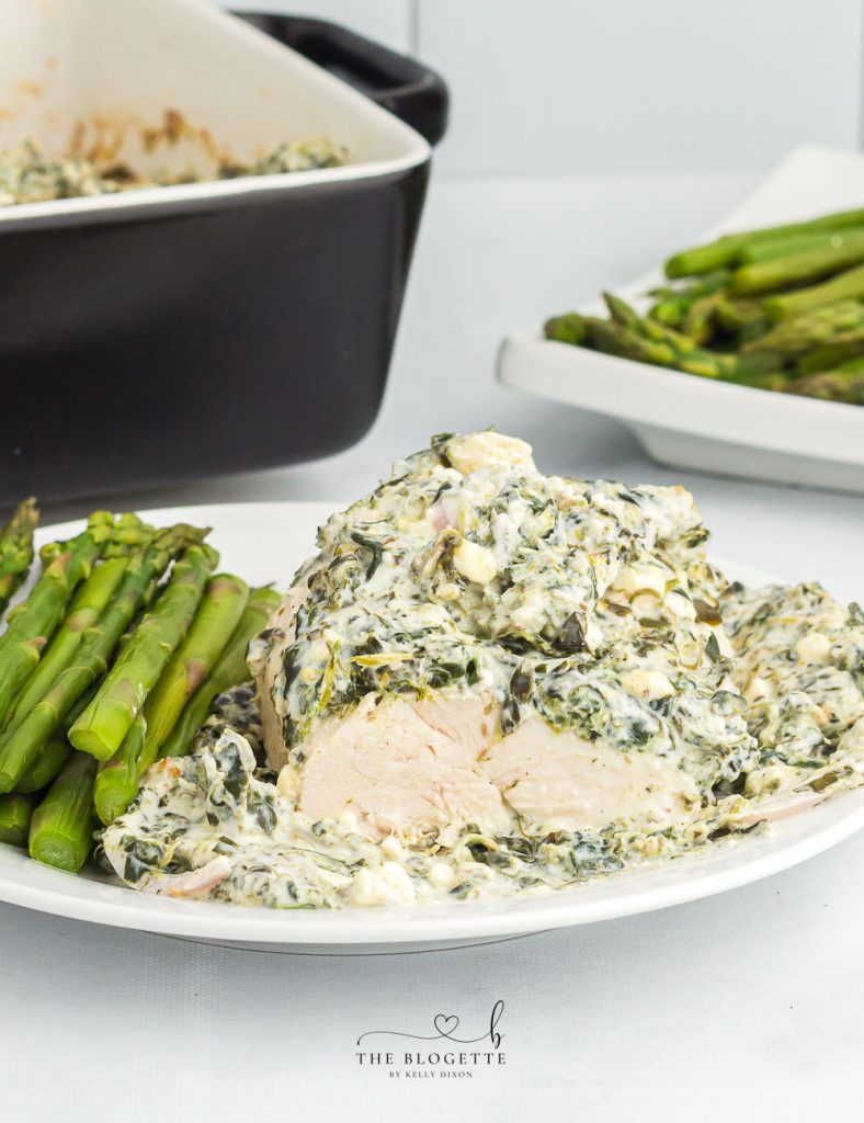 Spinach Dip Chicken Bake - Baked to perfection in 45 minutes! Creamy spinach cheese sauce smothered onto juicy chicken breasts.