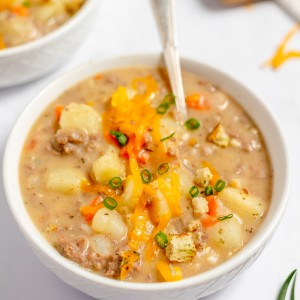 Cheeseburger Soup Recipe - Loaded with ground beef, cheese, potatoes, and creamy broth, this is a soup recipe you need to always keep on hand!