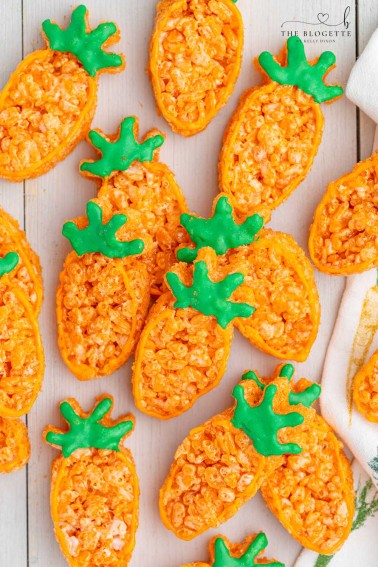 Carrot Rice Krispie Treats are a perfect Easter dessert! Everyone's favorite Rice Krispies Treats turned into little carrots.