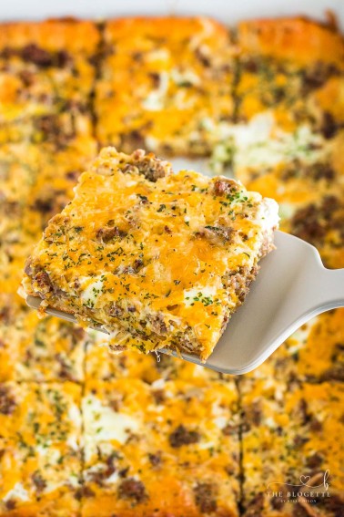 The best Breakfast Sausage Casserole with a layer of cheese, eggs, crescent dough, and sausage!