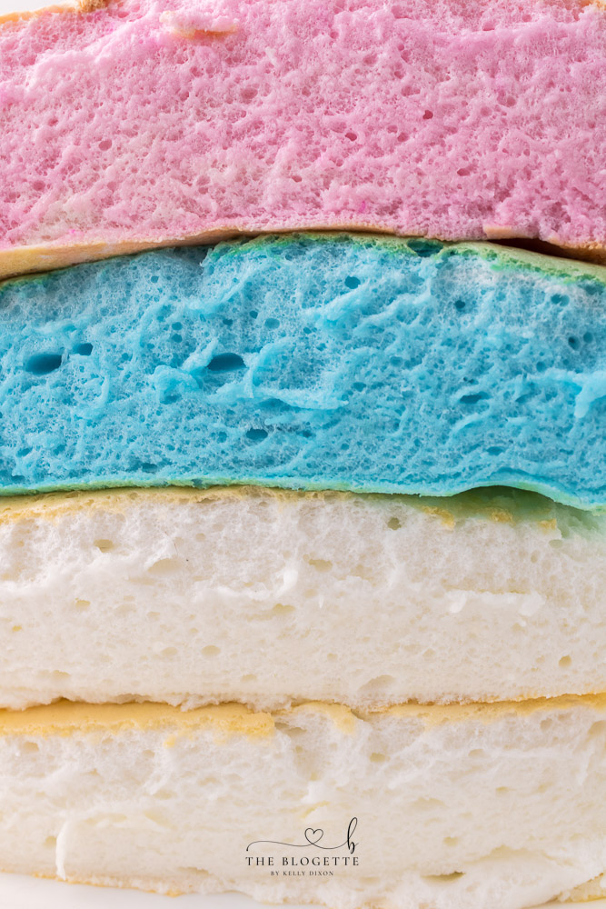 Soft and fluffy cloud bread is easy to make and tastes almost like cotton candy! It is fun to rip open, revealing the colorful bread inside.