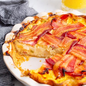 Maple Bacon Breakfast Pie has all of your favorite ingredients - eggs, bacon, cheese, and potatoes, all baked in a pie crust!