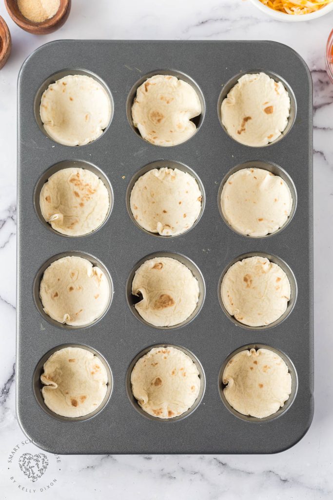 Flour tortillas in a muffin tin