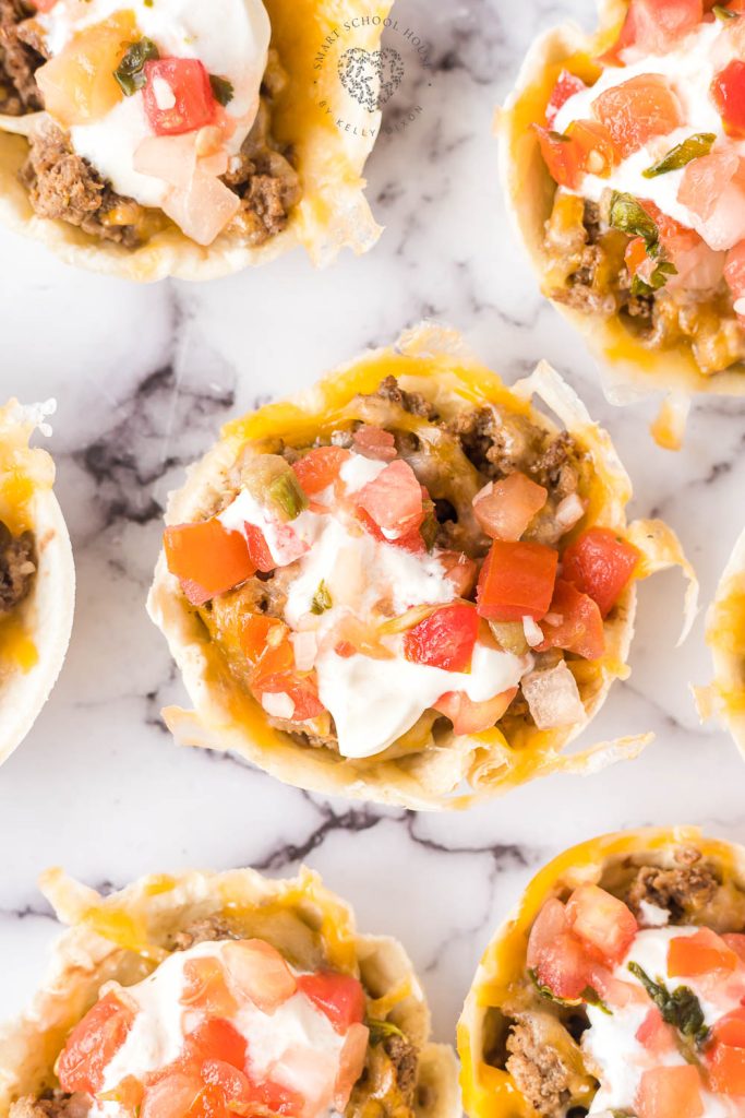Taco Cups are a great appetizer or twist on Taco Tuesday! Beef and cheese stuffed inside bite-size flour tortillas and baked to perfection.