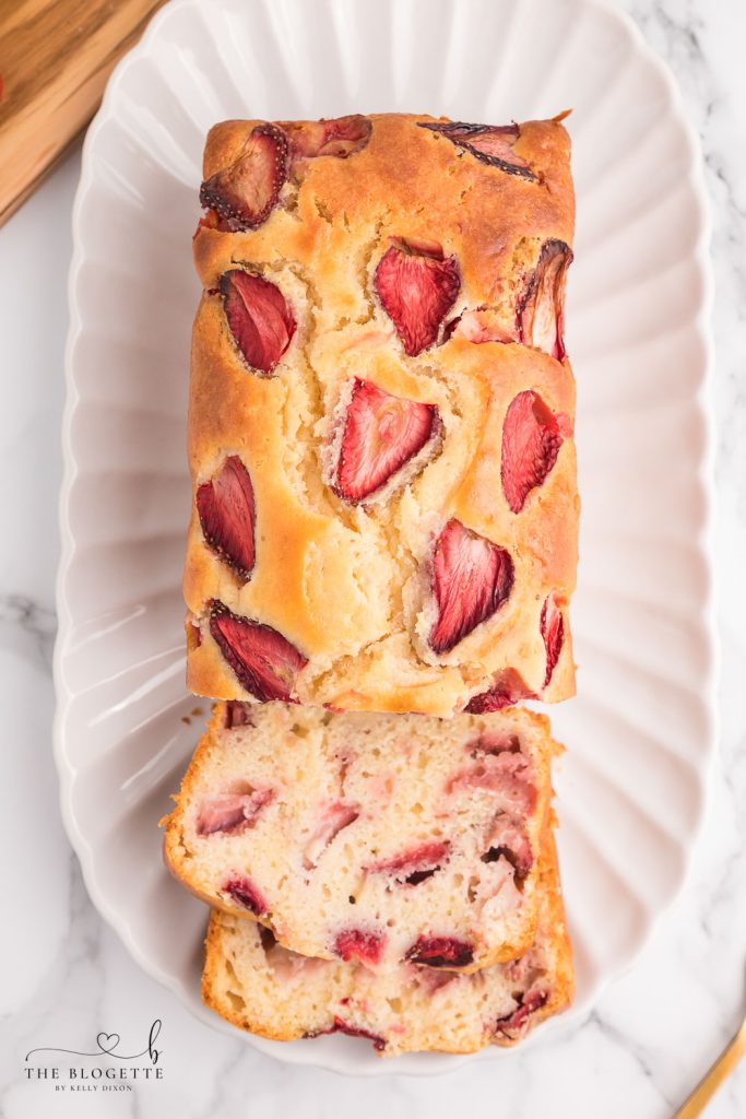 Sweet and soft Strawberry Bread is a spring and summer staple treat! Made with fresh strawberries, this quick bread recipe is the perfect way to enjoy strawberries while they're in season.