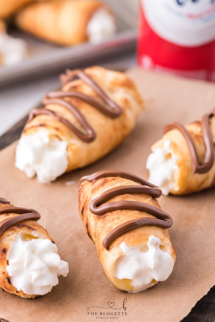 Decadent Campfire Éclairs are the perfect camping recipe and are sure to be the highlight of your summer camping trip!