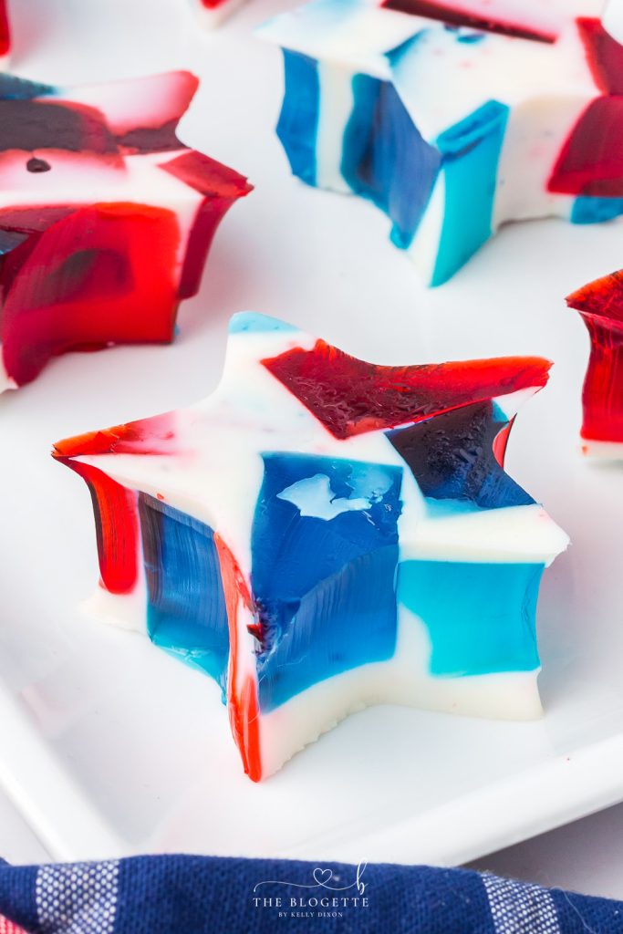 Patriotic Red, White, and Blue Jello Stars! Layers of Jello glass make up this colorful and fun dessert for all the Patriotic holidays!