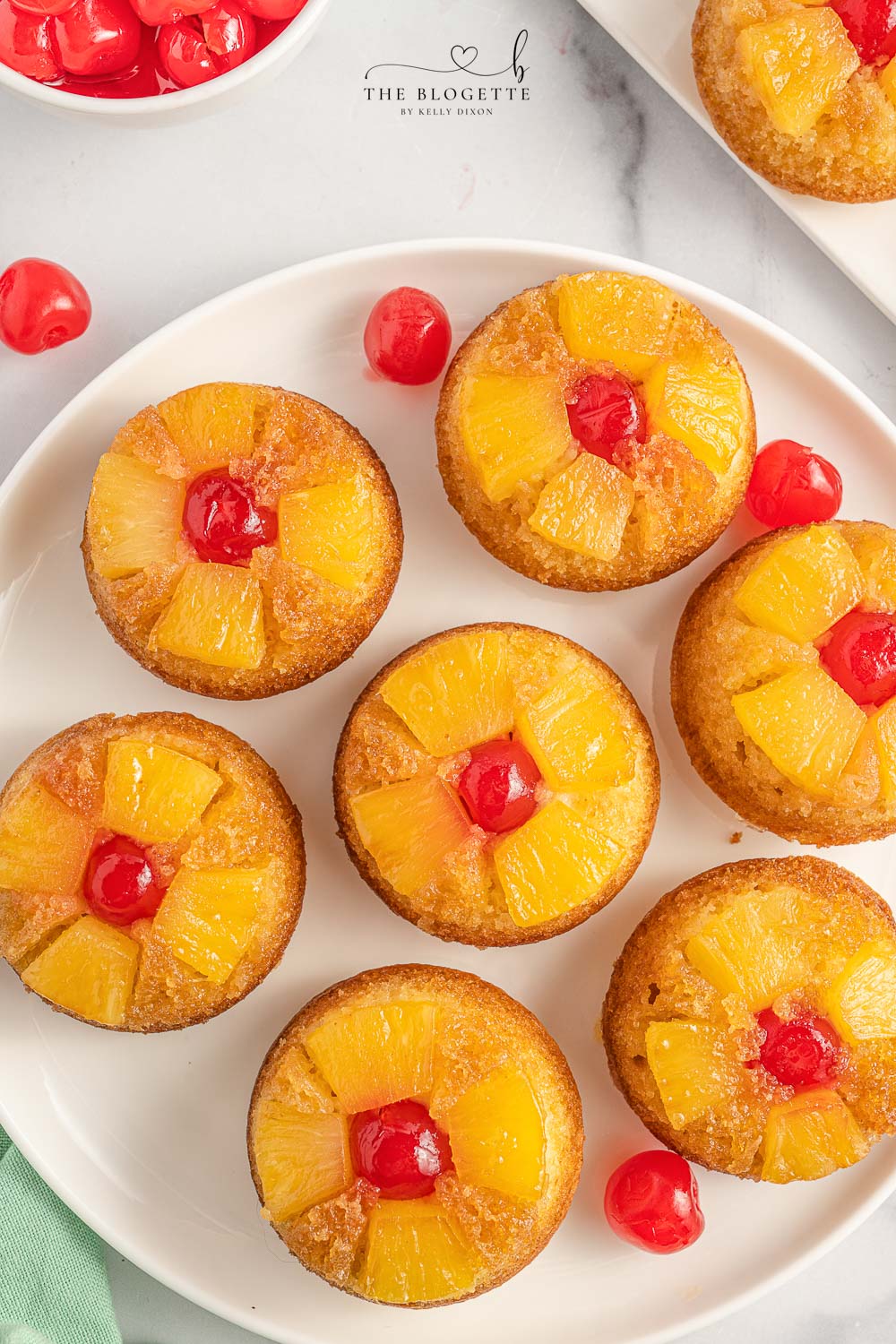 Easy Pineapple Upside Down Cupcakes Recipe! Soft, buttery sweet cupcakes with a moist top, tender pineapple pieces, and cherry on top. 