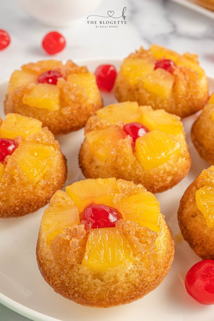 Easy Pineapple Upside Down Cupcakes Recipe! Soft, buttery sweet cupcakes with a moist top, tender pineapple pieces, and cherry on top. 