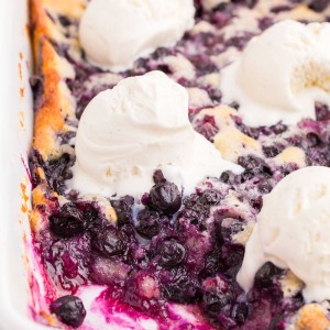 Blueberry Cobbler is a delicious and easy recipe to use with all of those summer blueberries! It's a quick and easy dessert topped with a scoop of vanilla ice cream.