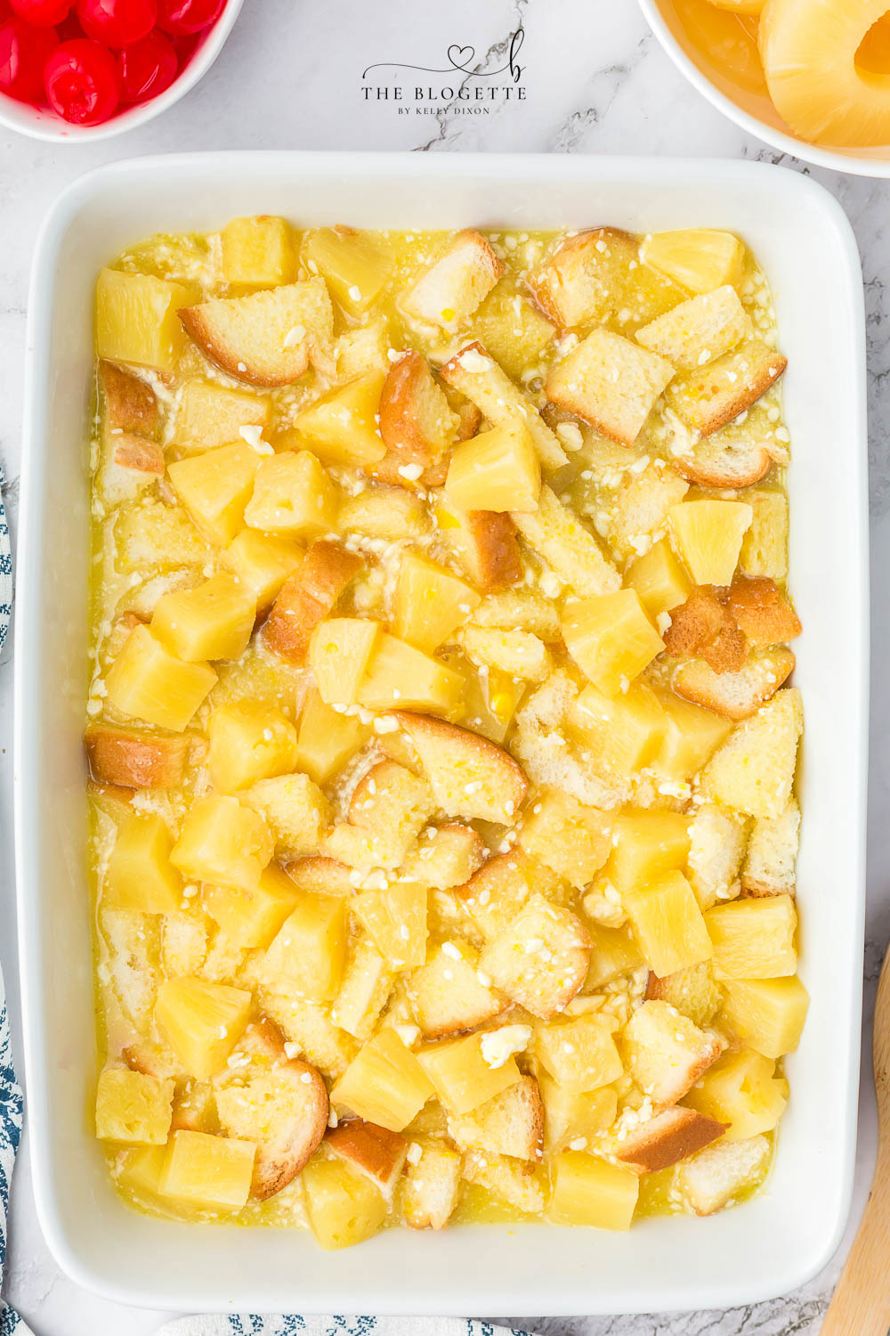 Pineapple mixture over bread in baking dish