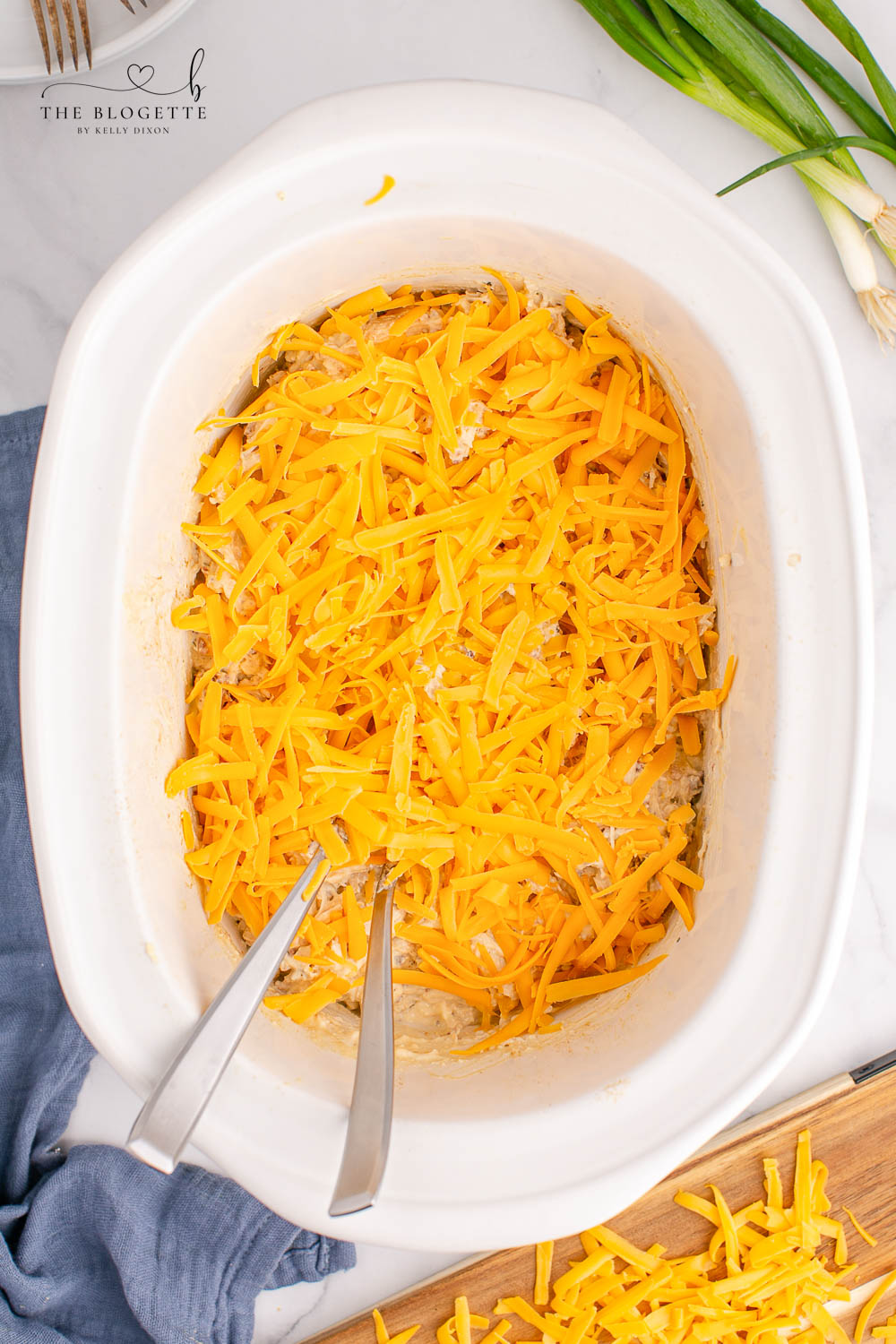 Cheese over chicken in slow cooker