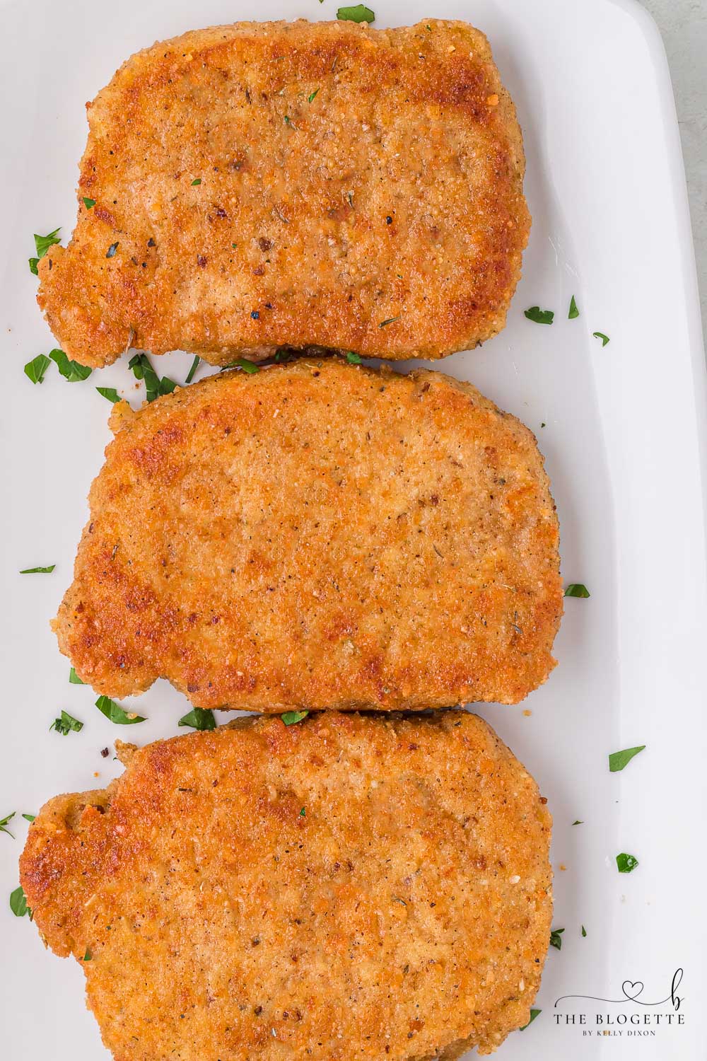 Breaded Fried Pork Chops cooked to crispy perfection! Golden brown boneless pork chops are crispy on the outside and juicy on the inside.