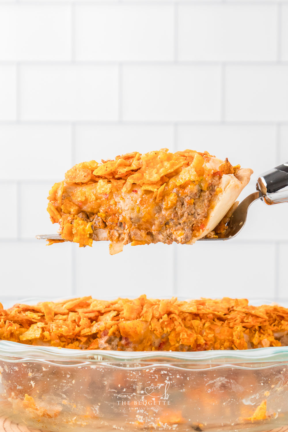 This Easy Dorito Pie Recipe is made with a pie crust, ground beef, Cool Ranch or Nacho Cheese Doritos, and a creamy cheese sauce!