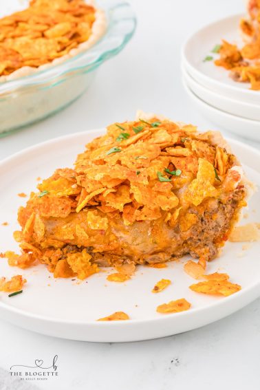 This Easy Dorito Pie Recipe is made with a pie crust, ground beef, Cool Ranch or Nacho Cheese Doritos, and a creamy cheese sauce!