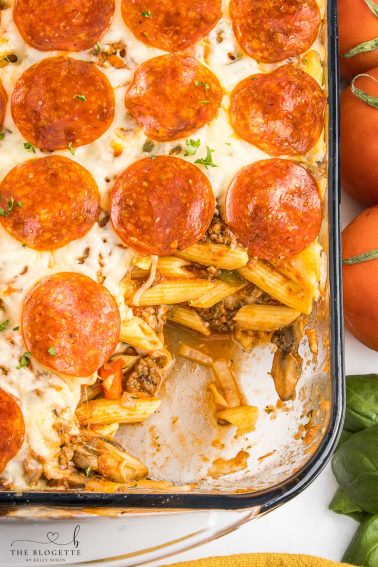 Pizza casserole has layers of pasta, sauce, and ooey-gooey cheese, along with your favorite pizza toppings.