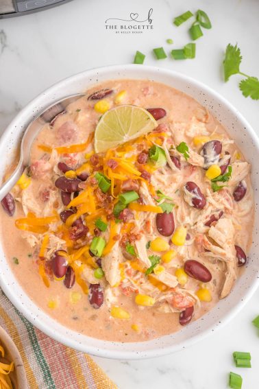 Slow Cooker White Chicken Chili is a mouthwatering dish that is a perfect blend of creamy flavors. The BEST crock pot chicken chili recipe!