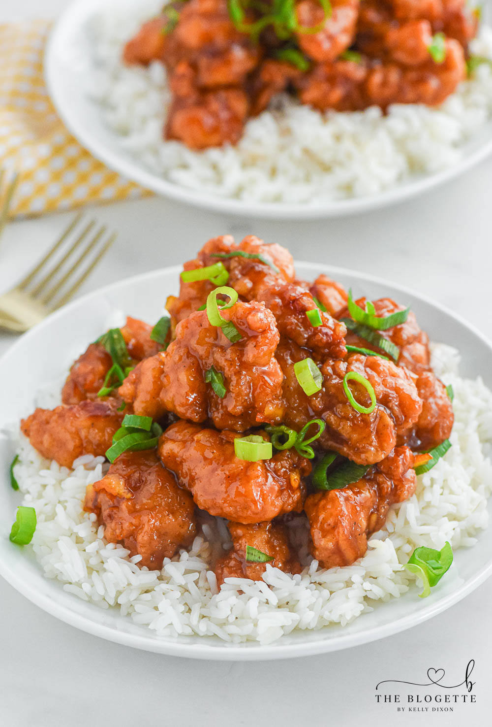 Orange Chicken that's made with 4 ingredients! Yummy bites of chicken covered in a sweet and flavorful orange sauce. 30-minute dinner recipe!