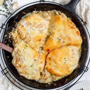French Onion Chicken features juicy chicken breast, melted butter, caramelized onions, and lots of gooey melted cheese all cooked in one fabulous skillet.
