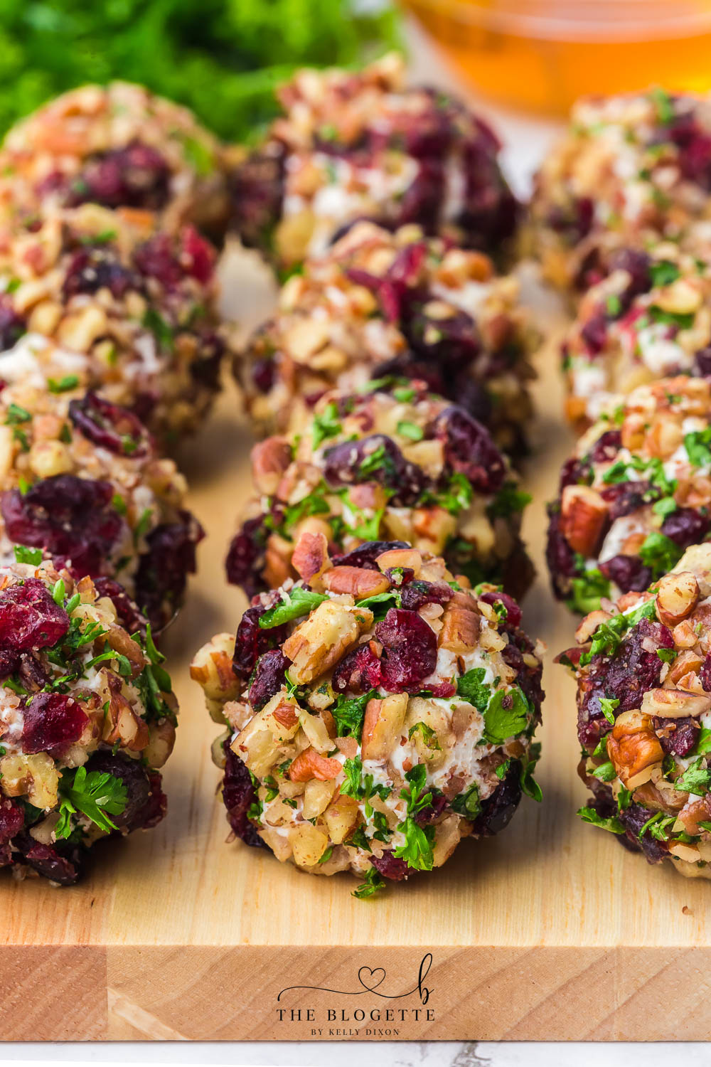 Cranberry Pecan Goat Cheese Balls are festive mini cheese truffles loaded with creamy goat cheese, sweet cranberries, and crunchy pecans!