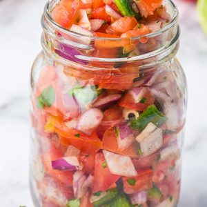 Homemade Pico de Gallo is so fresh and easy to make! Featuring fresh tomatoes, jalapeños, onions, cilantro, and more.
