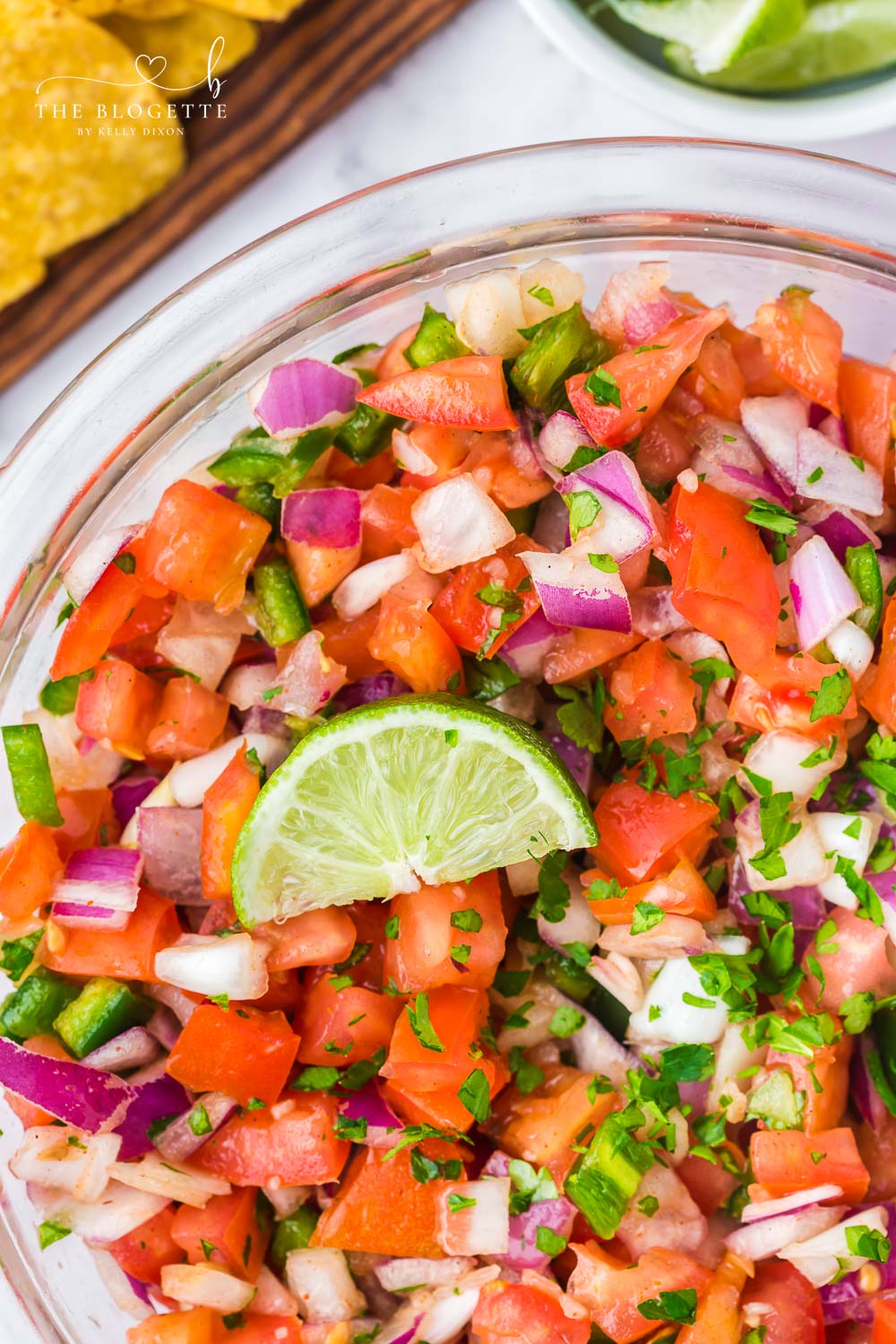 Homemade Pico de Gallo is so fresh and easy to make! Featuring fresh tomatoes, jalapeños, onions, cilantro, and more.