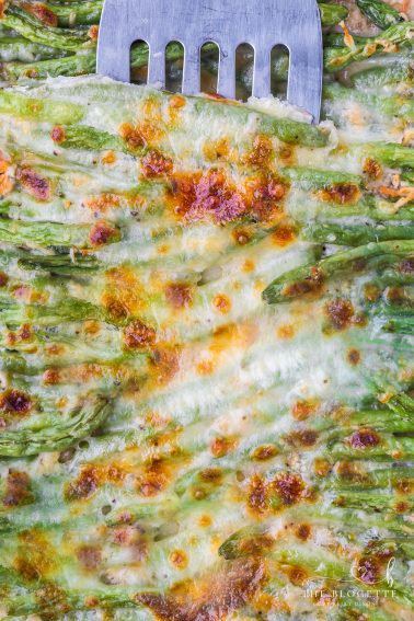 Cheesy Garlic Baked Green Beans! A wonderful veggie side dish for holidays or for a weeknight dinner. Low-carb and keto-friendly recipe!