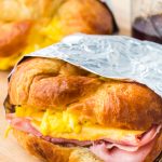 Croissant Breakfast Sandwiches are the ultimate breakfast comfort! Buttery flakey bread stuffed with eggs, ham, and melted cheese.
