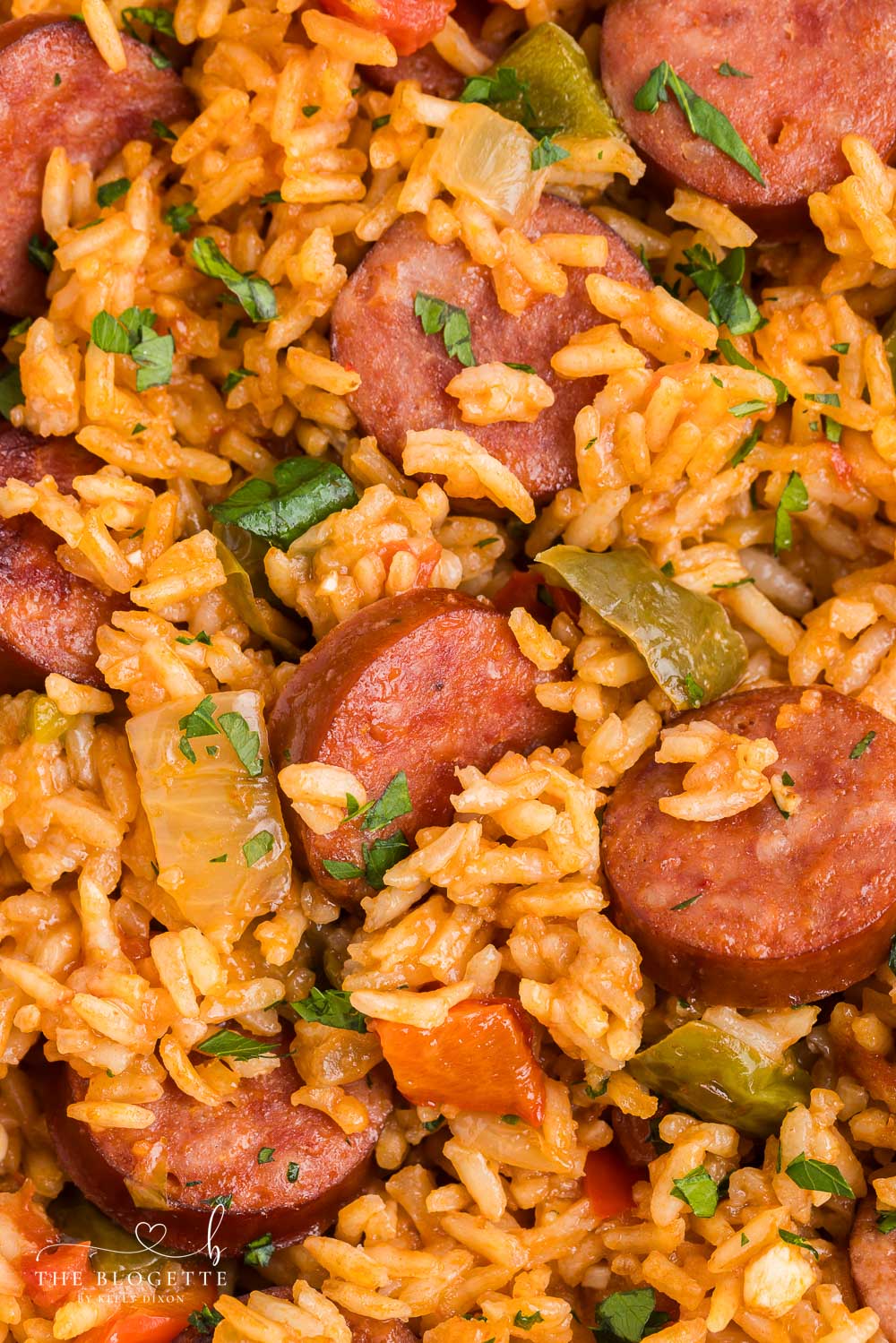 This Sausage and Rice Skillet features smoky sausage sizzled with sweet bell pepper, onions, and garlic in vibrant tomato sauce.