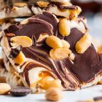 Snickers Frozen Bark is everything you love about the flavors of a Snickers Bar! Chocolate, caramel, peanuts, and thick frozen yogurt.